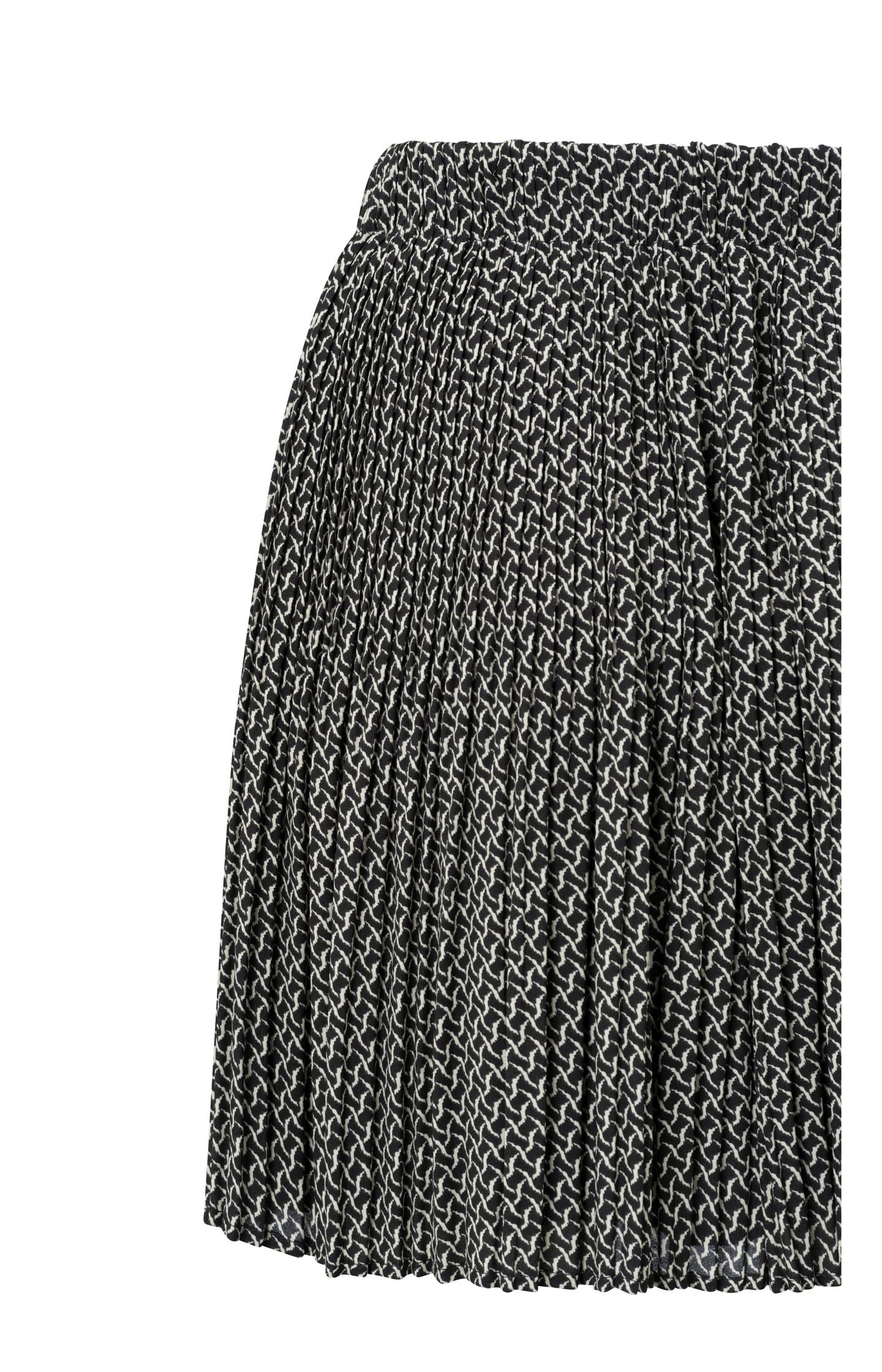 Black pleated skirt with subtle print and elastic waist