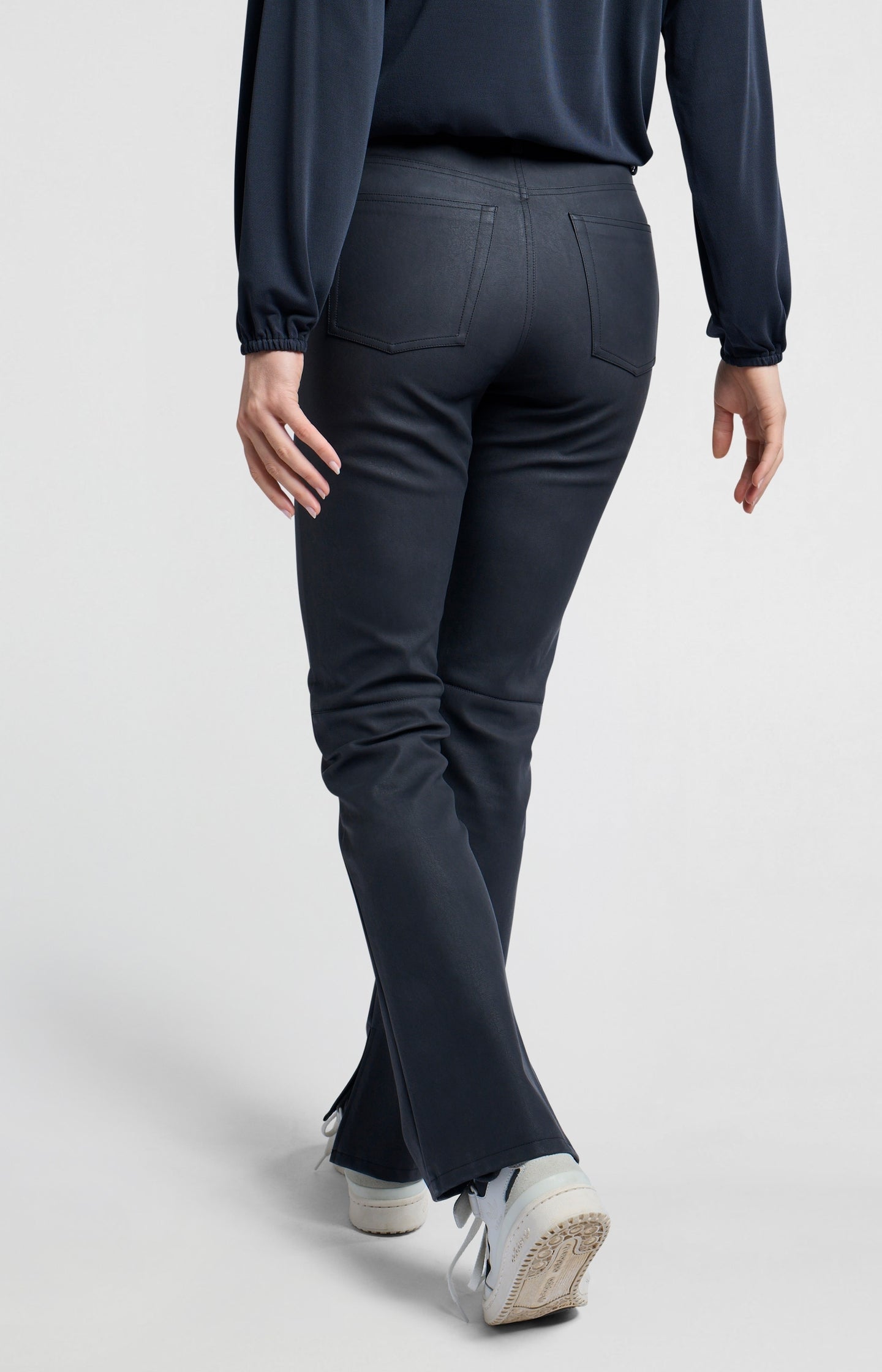 Faux nubuck leather pants with high waist, pockets and slit