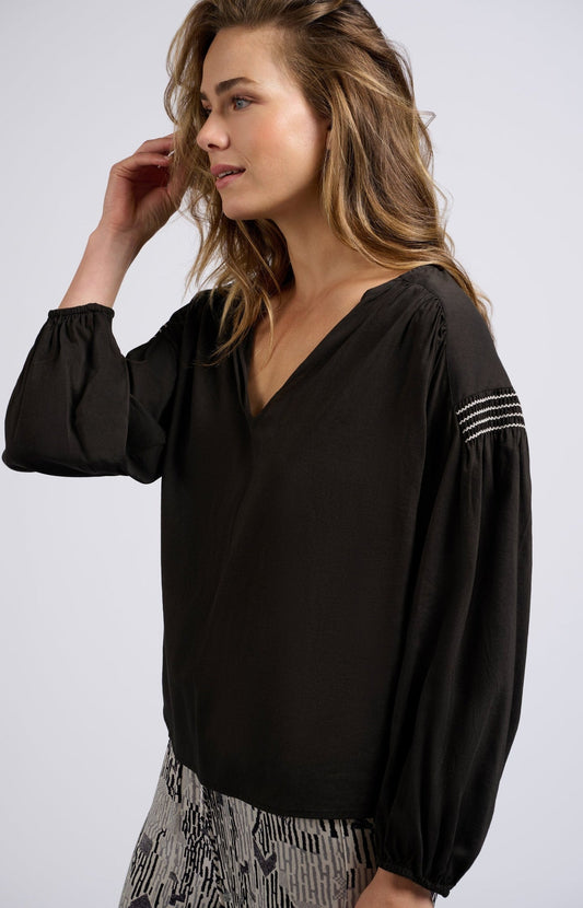 Woven top with V-neck, long sleeves and shoulder details